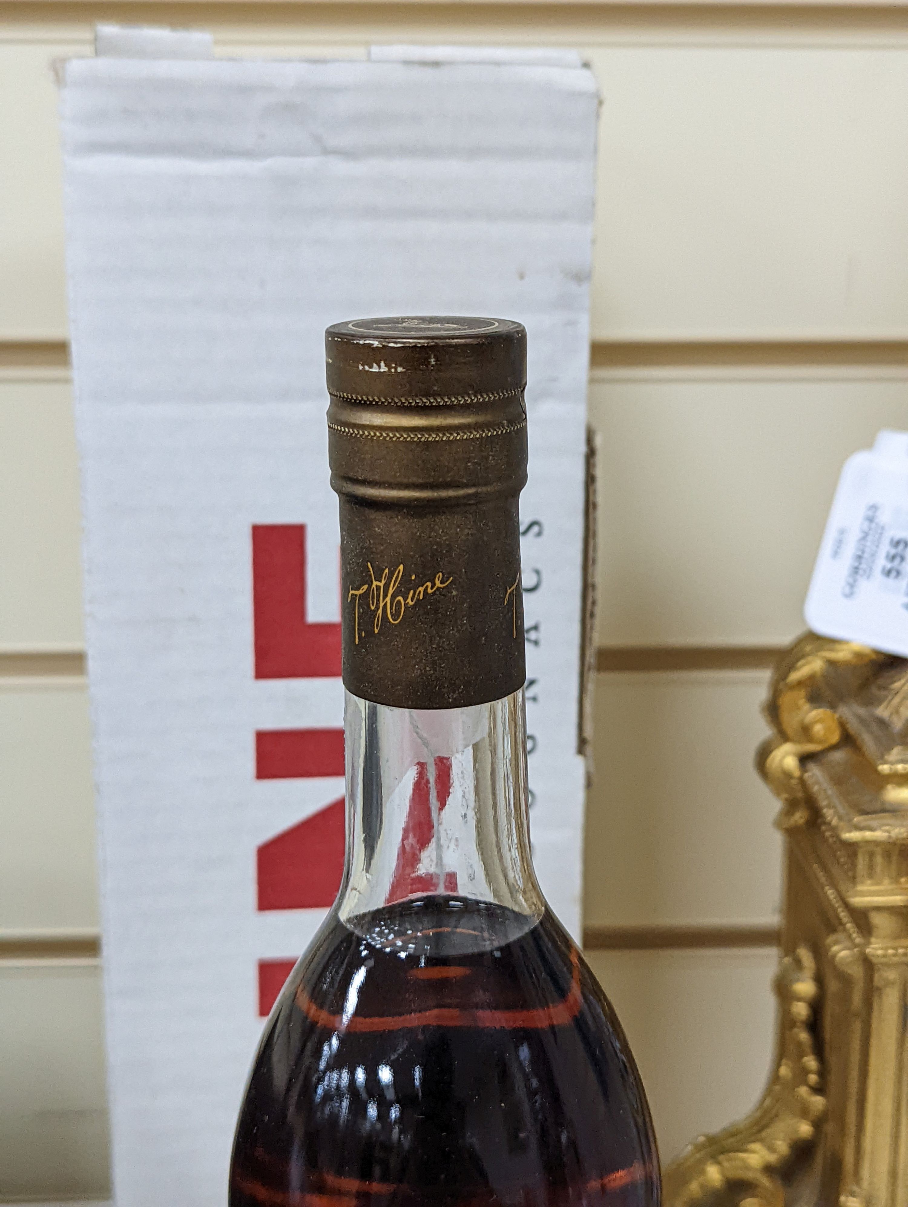 One bottle of Hine Grand Champagne Cognac, 1975. Original cardboard box.